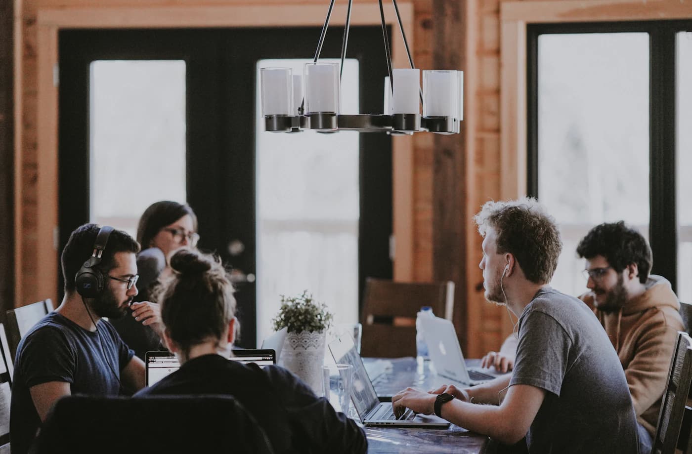 IGA Global advisors in discussion with clients around a meeting table