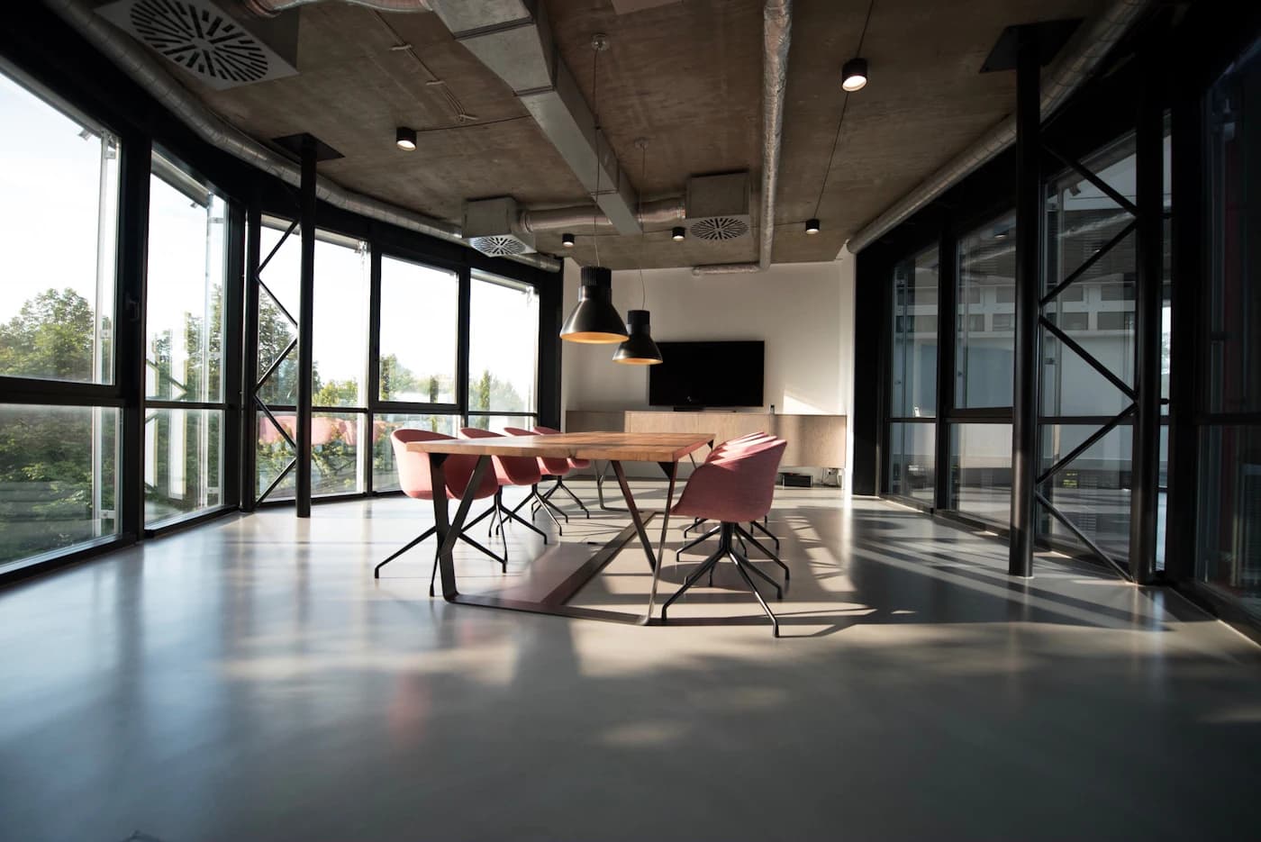 Bright modern office interior with floor-to-ceiling glazing